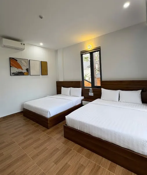 Phòng ngủ 2 giường tại Gemstone Villa Măng Đen sạch sẽ và rộng rãi